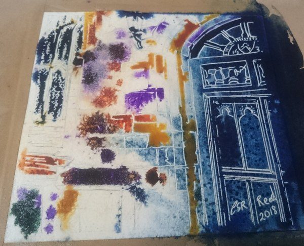 Painting in progress of buttress on Maids Moreton Church showing details of a leaded window and big wooden door