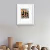 Room setting with and A4 print of Passing the Portico Library, an original painting by Contemporary artist Cathy Read. Featuring the Portico Library in Manchester.