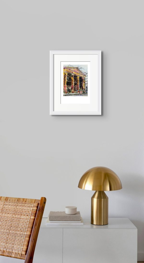 Room setting with and A4 print of Passing the Portico Library, an original painting by Contemporary artist Cathy Read. Featuring the Portico Library in Manchester.