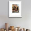 Room setting with and A3 print of Passing the Portico Library, an original painting by Contemporary artist Cathy Read. Featuring the Portico Library in Manchester.