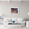 Room setting featuring an original painting Victorian Destinations by artist Cathy Read. Featuring an image of Victoria Station in Manchester.