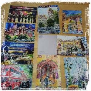 Images of postcards featuring Cathy Read's paintings